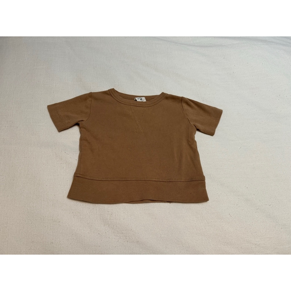 Kate Quinn | Unisex Brown Organic Cotton T-Shirt | 12-18m